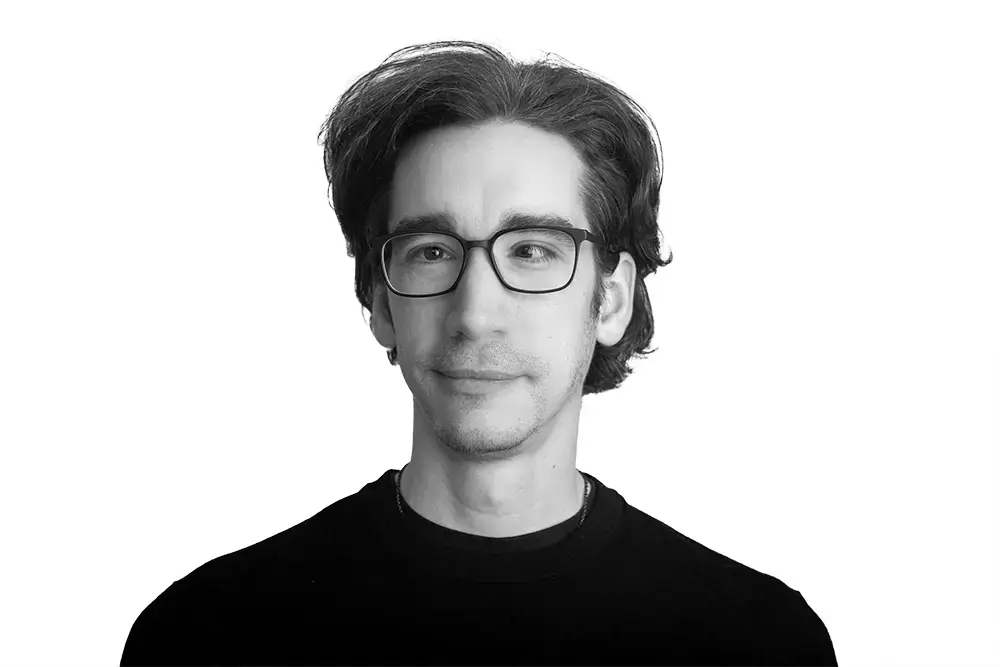 Black and white portrait of Raul Menezes